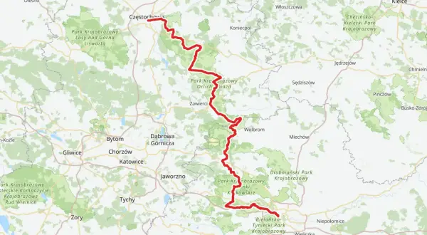 Mapa z zaznaczoną na czerwono trasą rowerową Szlak Orlich Gniazd, biegnącą przez malownicze tereny Jury Krakowsko-Częstochowskiej.